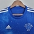 Camisa azul do Cruzeiro Esporte Clube, modelo I 22/23, com detalhes em branco e design inspirado no céu estrelado.

