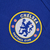 Camisa feminina azul do Chelsea, modelo 2022/2023, com logo da Nike e patrocinador na frente.

