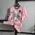 Camisa rosa do Everton, modelo away 22/23, com detalhes em azul e logotipo do time.

