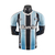 Camisa masculina do Grêmio, modelo I 22/23, nas cores azul e preto, com logo da Umbro e patrocínio da Banrisul.