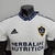 Camisa branca da LA Galaxy, modelo Home 22/23, com logo da Herbalife Nutrition e detalhes em azul.

