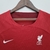 Camisa feminina vermelha do Liverpool, modelo Home 22/23, da Nike, com logo do time e patrocinadores.

