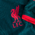 Camisa Liverpool Third 22/23 Torcedor Nike Masculina na cor azul petróleo, com detalhes em vermelho e logo do clube.

