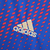 Camisa azul do Olympique Lyonnais, modelo Lyon IV 22/23, fabricada pela Adidas, com logotipo da equipe e patrocínio da Emirates.

