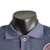 Camisa polo masculina do Inter Miami 23/24, na cor azul, com logo e detalhes em rosa.

