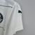 Camisa feminina branca do Palmeiras II 22/23, com detalhes em verde e logo da Puma.