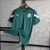 Camisa verde masculina do Palmeiras, modelo de treino 23/24 da Puma, com logo do time e detalhes em branco.