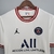 Camisa branca do Paris Saint-Germain para torcedores, modelo 21/22, com detalhes em vermelho e o logo da Nike.