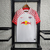 Camisa branca do Red Bull Leipzig I 23/24, com detalhes em vermelho e logo da Nike.

