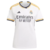 Camisa feminina do Real Madrid I 23/24 da Adidas, na cor branca, com detalhes em amarelo e preto.