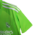 Camisa verde do goleiro do Real Madrid 23/24, com logo da Adidas e patrocínio Emirates.

