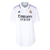 Camisa branca feminina do Real Madrid I 22/23 da Adidas, com logo e detalhes em roxo.