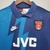 Camisa retrô azul marinho do Arsenal, modelo away de 95/96, com detalhes em azul claro e logo da Nike.

