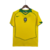 Camisa Retrô 2004 da Seleção Brasileira, cor amarela, com detalhes em verde e logo da Nike.