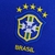 Camisa retrô azul da Seleção Brasileira II da Nike, com escudo e cinco estrelas.

