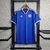 Camisa azul do Schalke 04, modelo torcedor Adidas 23/24, com detalhes em branco e logo do time.

