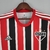 Camisa torcedor do São Paulo II 22/23, com listras vermelhas, pretas e brancas, confeccionada pela Adidas.