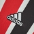 Camisa torcedor do São Paulo II 22/23, com listras vermelhas, pretas e brancas, confeccionada pela Adidas.