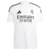 Camisa do Real Madrid I 24/25, branca com detalhes em preto, com logo da Adidas e patrocínio da Emirates.