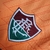 Camisa de goleiro treino laranja do Fluminense, com detalhes do escudo e logo da Betano.