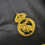 Camisa feminina do Real Madrid III 23/24, preta com detalhes em cinza e logotipo da Adidas.

