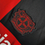 Camisa do Bayer Leverkusen I 24/25 masculina, preta com detalhes em vermelho e logo do time.

