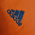 Camisa retrô laranja do Real Madrid II 13/14 masculina, com detalhes em cinza e logo da Adidas.

