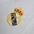 Camisa retrô branca do Real Madrid, modelo I 02/03, da Adidas, com logo do time e detalhes em preto.

