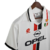 Camisa retrô branca do AC Milan II, modelo 1995/1997, com detalhes em vermelho e preto, logotipo da Opel e emblemas da equipe.

