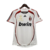 Camisa retrô do AC Milan 2006/2007, branca com detalhes em vermelho e logo da Adidas.