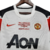 Camisa retrô branca do Manchester United, temporada 2010/2011, com detalhes em vermelho e preto, logotipo da Nike e inscrição "FINAL LONDON 2011".

