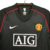 Camisa retrô preta do Manchester United da temporada 2007/2008, fabricada pela Nike, com logotipo do time e patrocinador em destaque.

