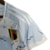 Camisa feminina azul da seleção da Bélgica 23/24, feita pela Adidas, com detalhes em branco e o escudo da seleção.

