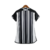 Camisa feminina do Atlético Mineiro I 23/24, com listras brancas e pretas e logotipo do clube.

