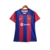 Camisa feminina do Barcelona I 23/24 da Nike, nas cores azul e grená, com logo da equipe e da Spotify.