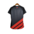 Camisa feminina do Athletico Paranaense II 23/24, na cor preta, com detalhes em vermelho e logotipo da Umbro.