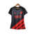 Camisa feminina do Athletico Paranaense II 23/24, na cor preta, com detalhes em vermelho e logotipo da Umbro.