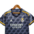 Camisa feminina do Real Madrid, modelo Away 23/24, na cor cinza com detalhes em amarelo.

