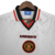 Camisa retrô branca do Manchester United da temporada 1996/1997, fabricada pela Umbro, com logotipo e patrocinador em destaque.

