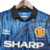 Camisa retrô do Manchester United, modelo azul da temporada 1992/1993, com estampas e detalhes em preto e o logo da Umbro.

