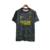 Camisa cinza do Paris Saint-Germain IV 23/24, fabricada pela Nike, com detalhes em amarelo e logo do time.