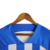 Camisa do Brighton & Hove Albion na cor azul e branca, com listras verticais e o logo da Nike.

