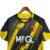 Camisa do Watford Home 23/24 com design em amarelo e preto, confeccionada pela Kelme, modelo masculino

