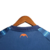 Camisa azul do Valencia CF, modelo away 23/24, com detalhes em laranja e logo da Puma.

