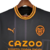 Camisa preta do Valencia II 22/23, modelo torcedor da Puma, com detalhes em laranja e logo do time.

