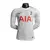 Camisa branca de manga longa do Tottenham, modelo 23/24, com logo da Nike e estampa "AIA" em vermelho.