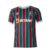 Camisa do Fluminense I 23/24 para torcedores, com listras tricolores em verde, grená e detalhes brancos.