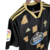 Camisa preta do Celta de Vigo II 22/23, modelo torcedor Adidas, com detalhes em dourado e logotipo da Estrella Galicia.

