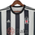 Camisa do Besiktas II 22/23, modelo masculino, com listras pretas e brancas, da Adidas.

