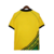 Camisa retrô da seleção da Jamaica de 1998, na cor amarela, com detalhes em verde e preto.

